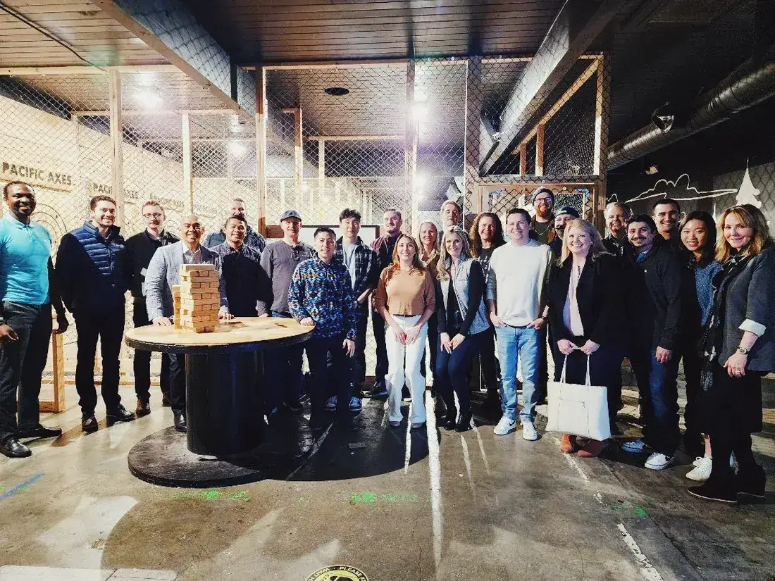 A large company group together at Pacific Axes in Redmond